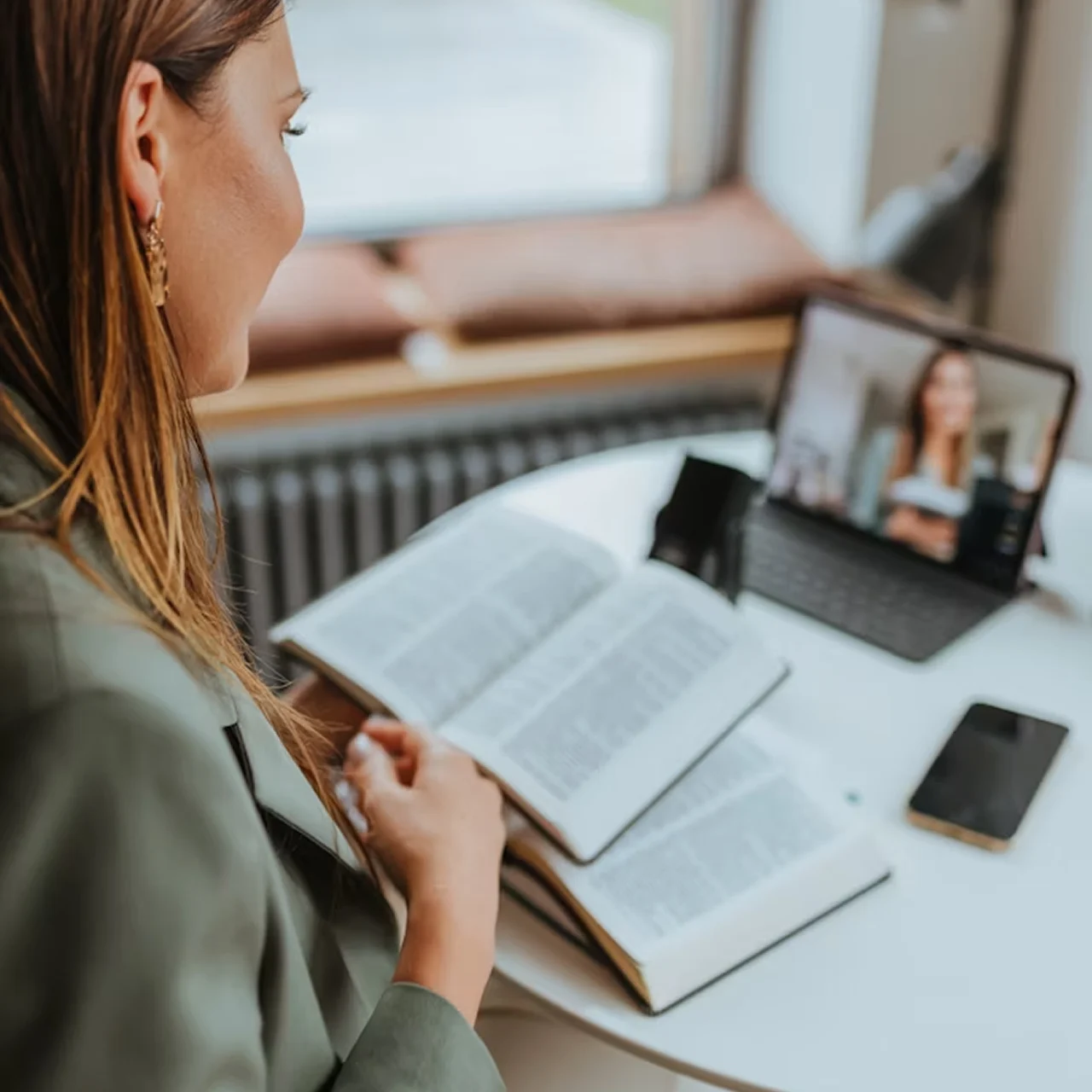 Woman talking to patient on an online meeting