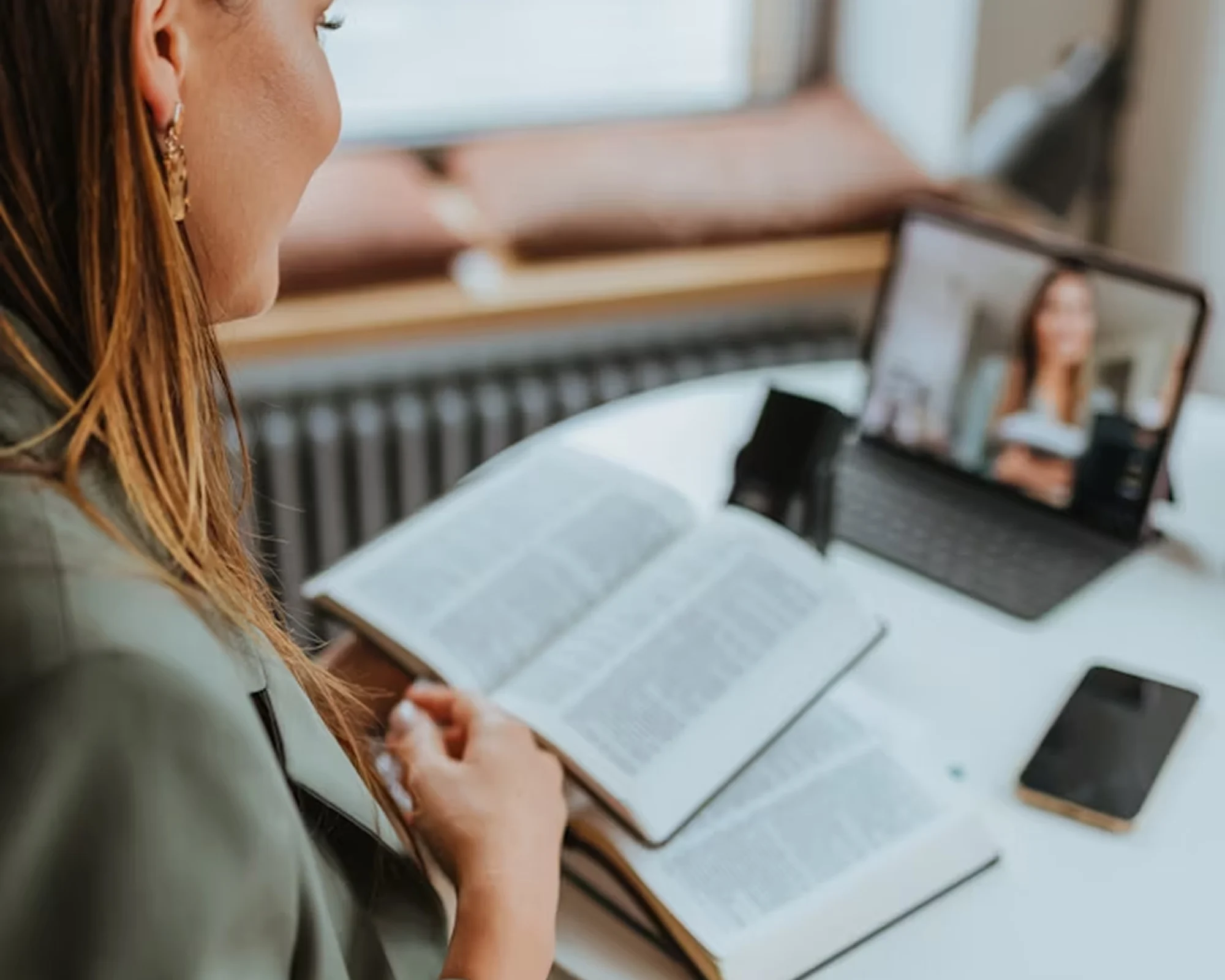 Woman talking to patient on an online meeting