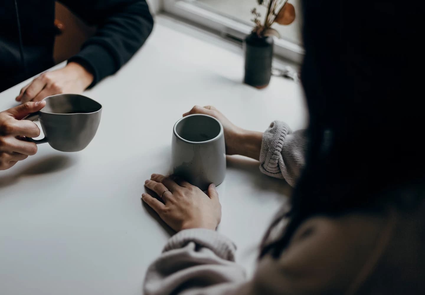 Two people meeting and drinking coffee